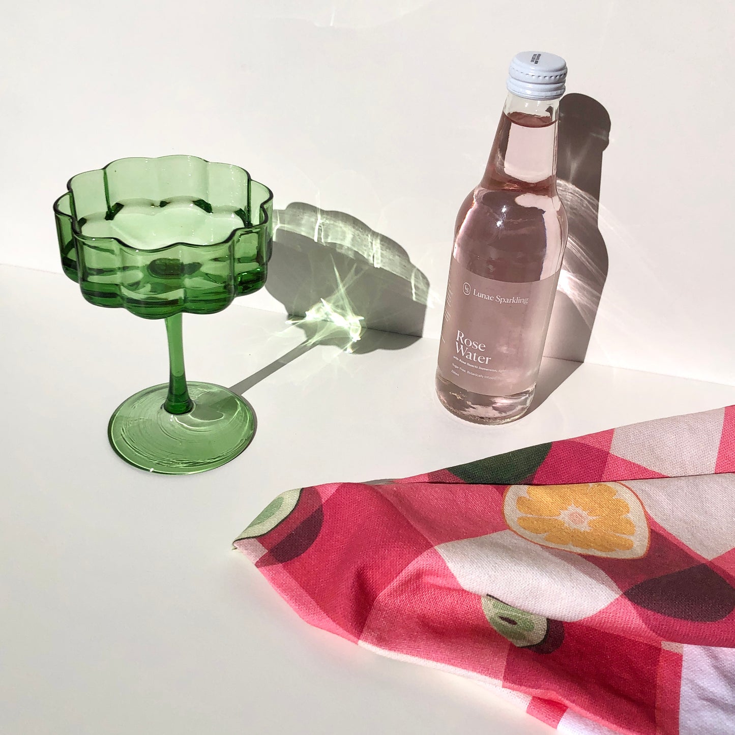 art tea towel of gingham checkered background in pink with lemons and limes
