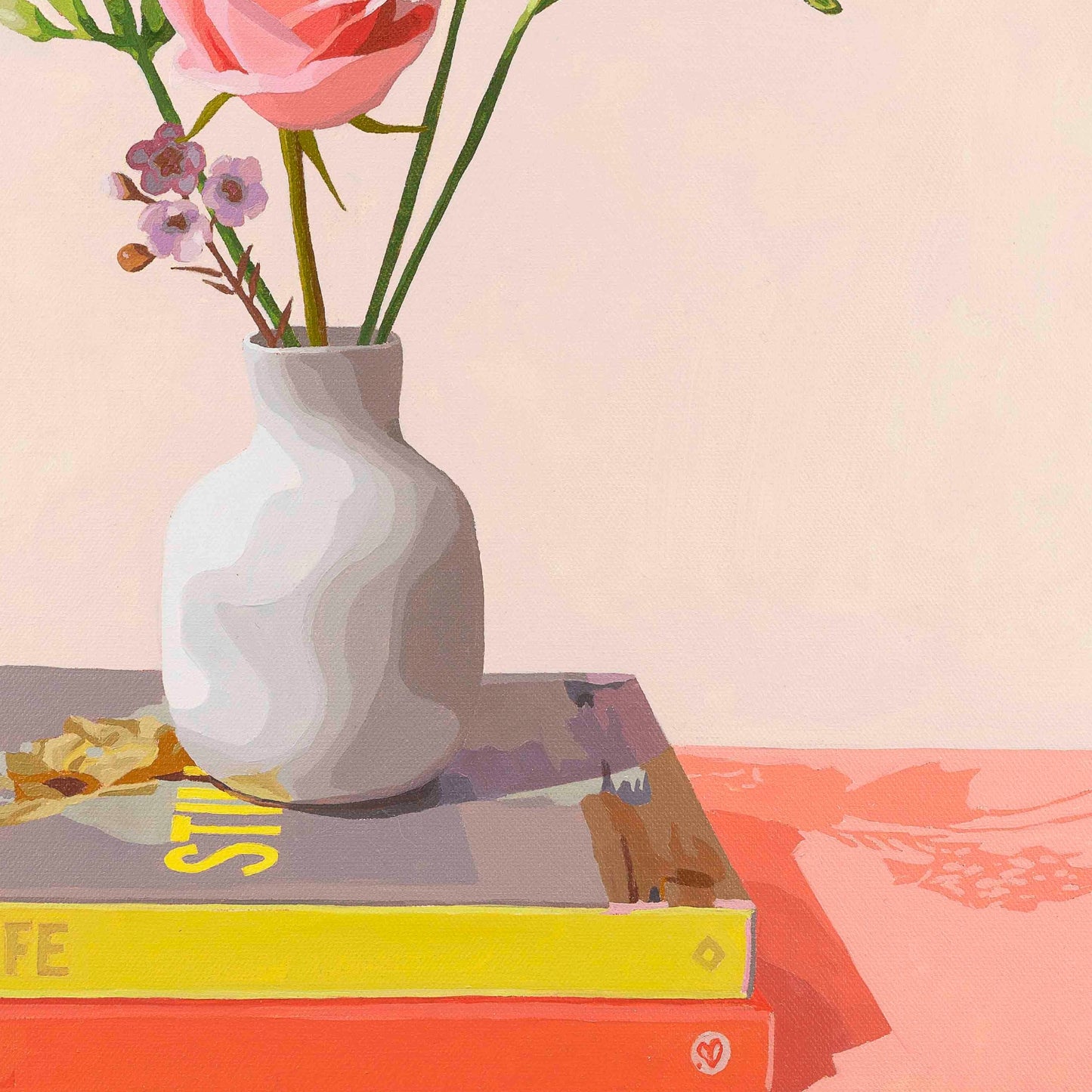White vase with flowers on a stack of books against a pink background