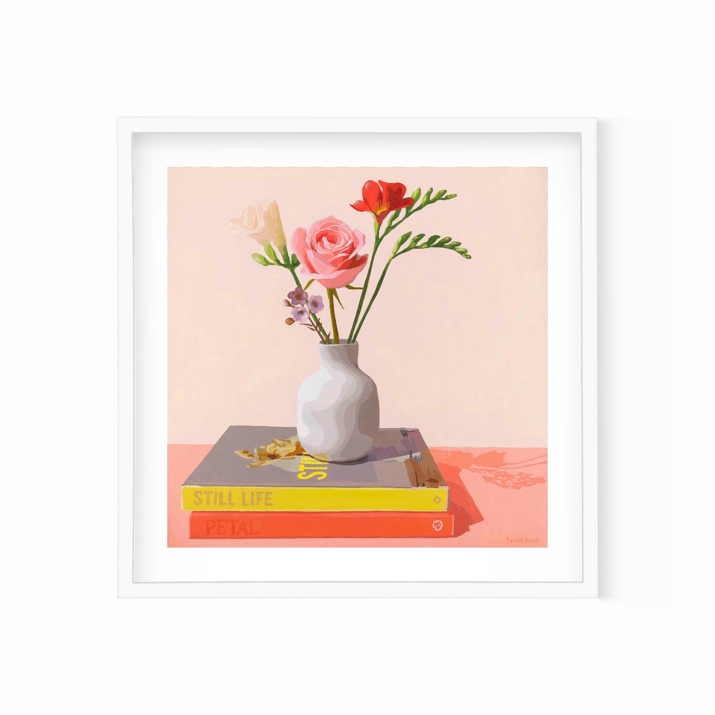 Framed artwork of a still life with flowers in a vase on books against a light creamy background.