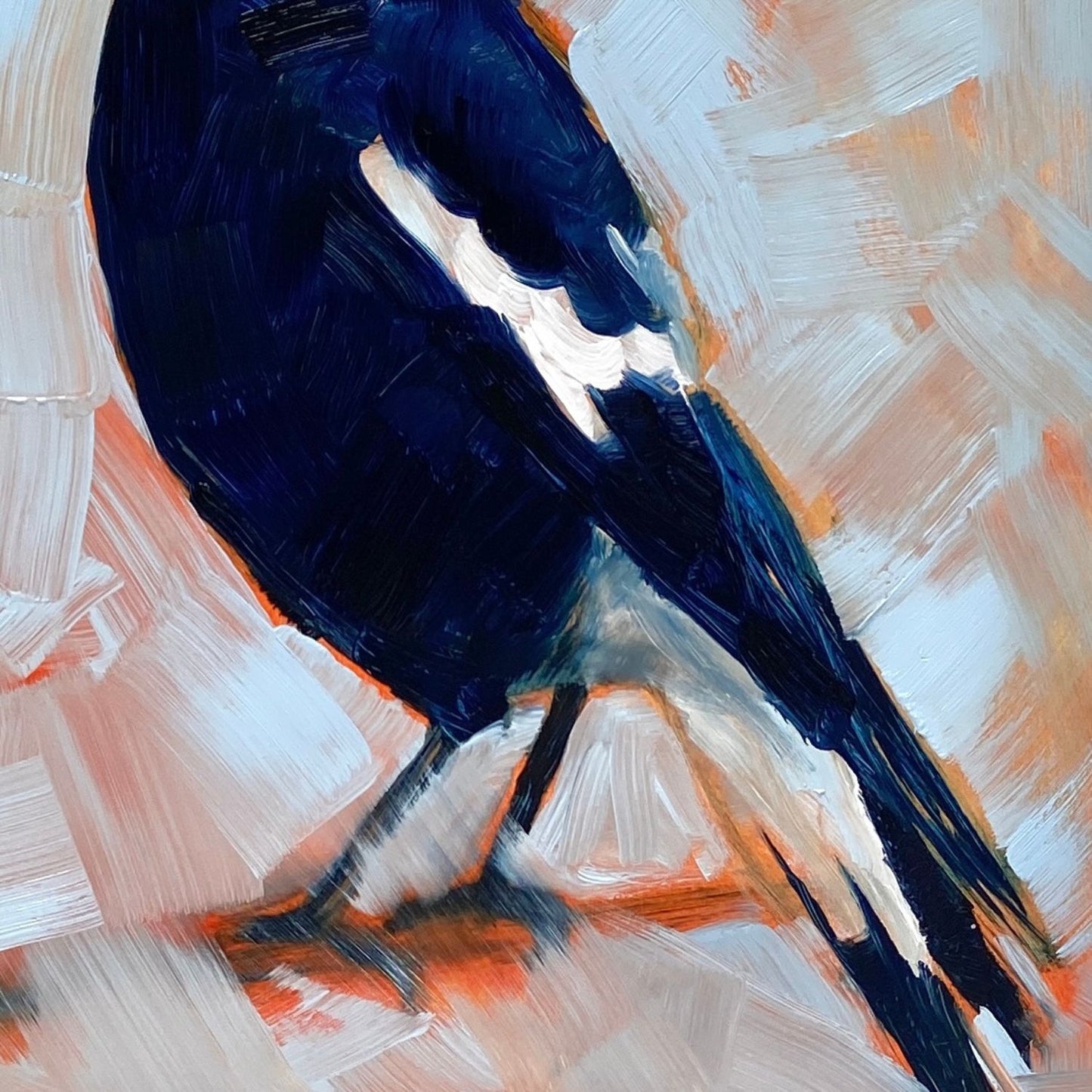 closeup of an original oil painting of a navy blue and white magpie on a textured sky blue background where you can see orange coming through