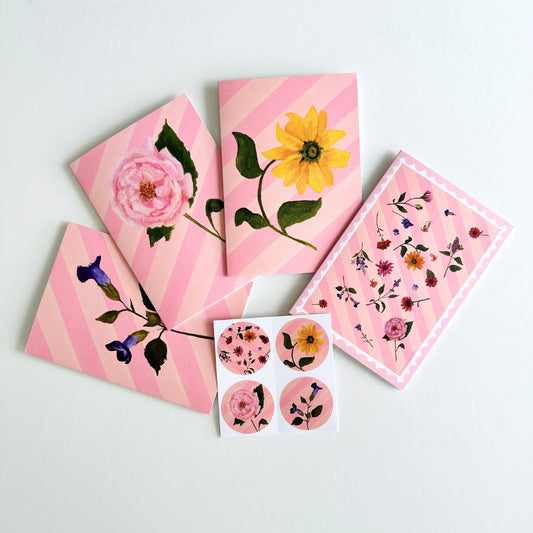 set of 4 greeting cards with pink and peachy stripes, pink scallops and a hand painted flowers. set comes with 4 matching stickers. blank inside