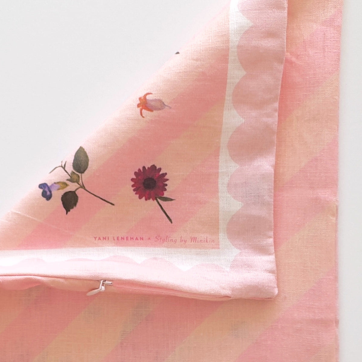 100% linen cushion with pink scallops, pink and peachy stripes and hand painted flowers
