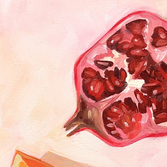 closeup of an impressionistic original oil painting of a still life setting of pomegranate fruit and three orange slices on a textured cream background with soft shadows