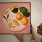 fine art print of a colorful and modern original oil painting of bright yellow lemons on a warm pink background with strong shadows