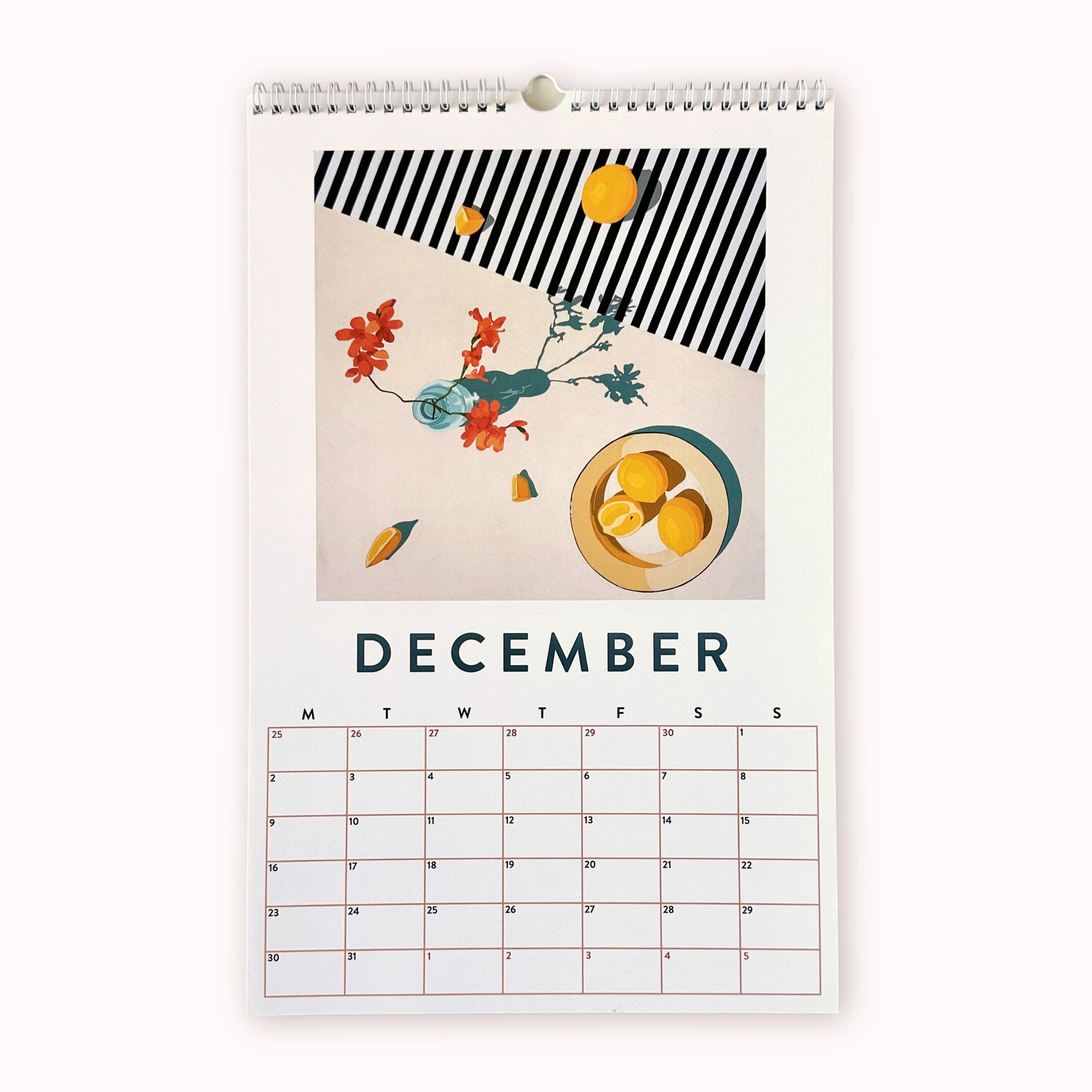 2024 art wall calendar in A3 size for the month of December, featuring a still life oil painting of lemons and a light blue vase with orange red flowers. they are sitting on a cream background partly covered with a navy blue and white striped pattern