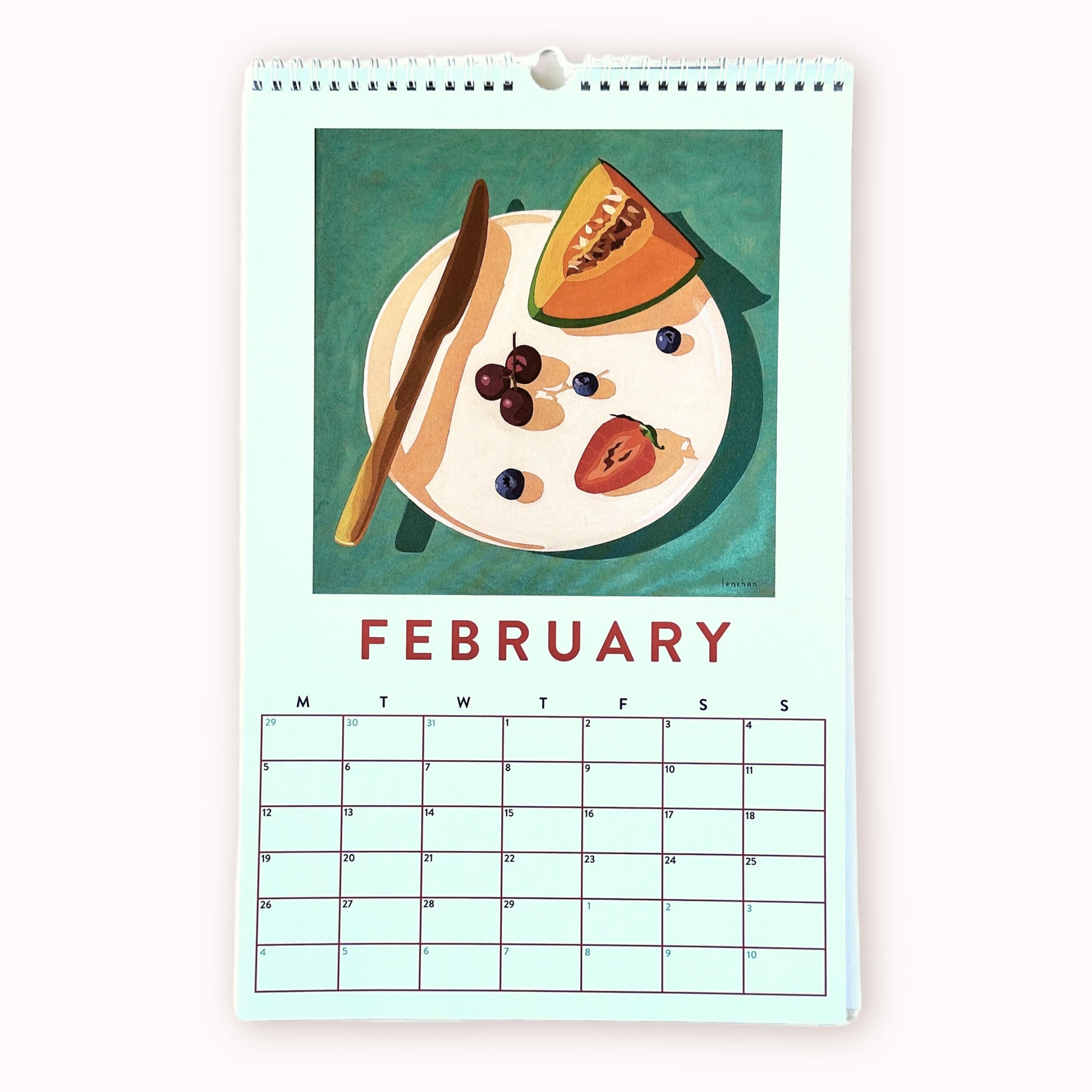 2024 art wall calendar for the month of February in A3 size featuring a still life oil painting of fruits such as orange rock melon, grapes, blueberries and strawberries, with a knife on a cream plate sitting on a teal background with strong shadows