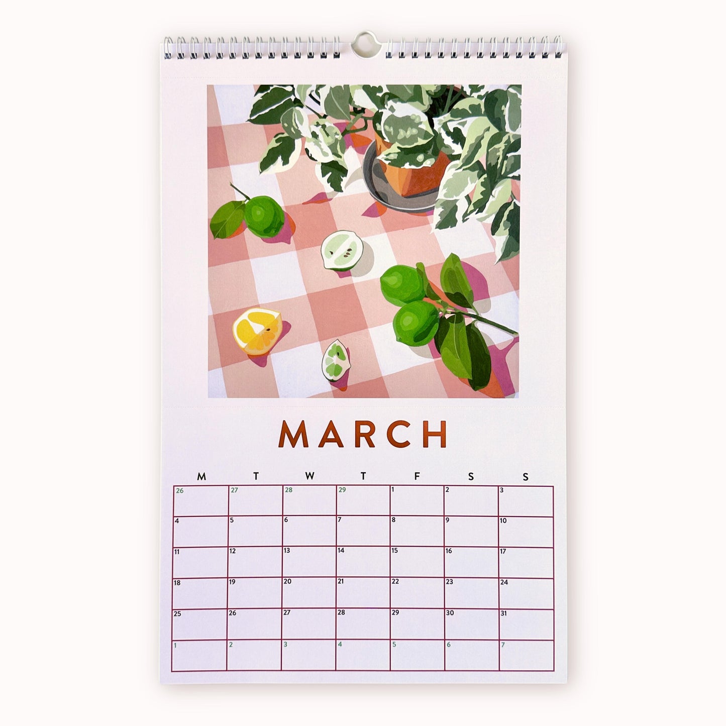 2024 art wall calendar in A3 size for the month of March, featuring a still life oil painting of fruits such as limes and lemon slices and a pot with plant leaves on a small plate, all on a soft creamy pink chequered background