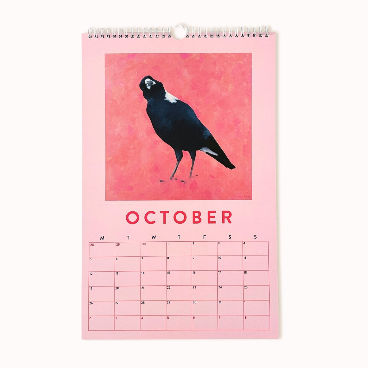 Calendar for October with a black bird illustration on a pink background