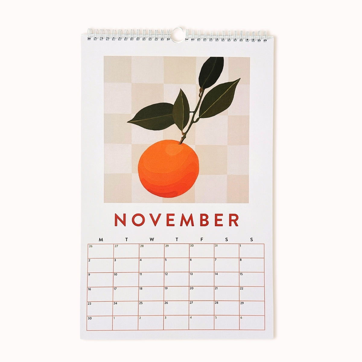 Calendar for November with an orange illustration on a checkered background