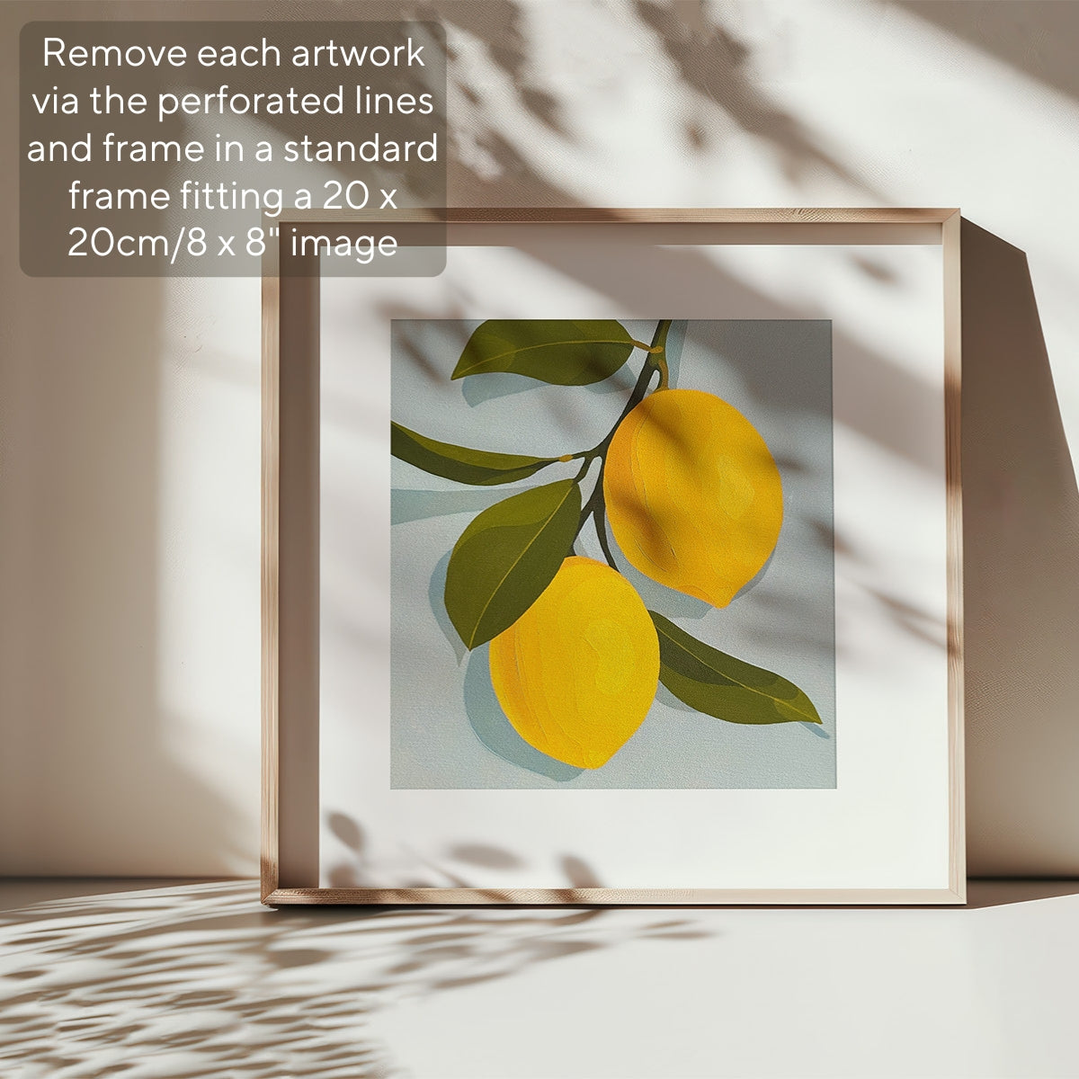 Framed artwork of lemons on a light background