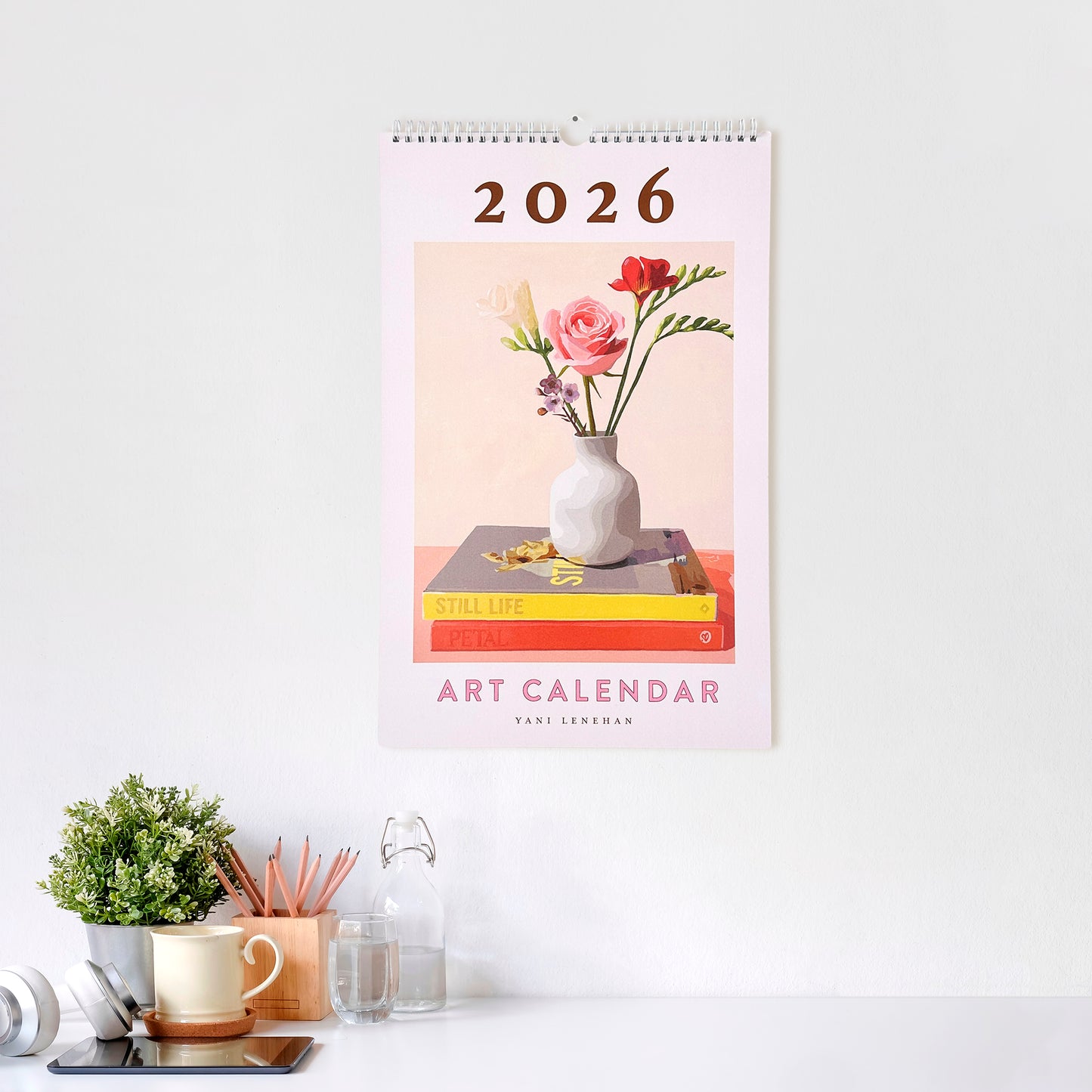 2026 art calendar with floral design on a white wall