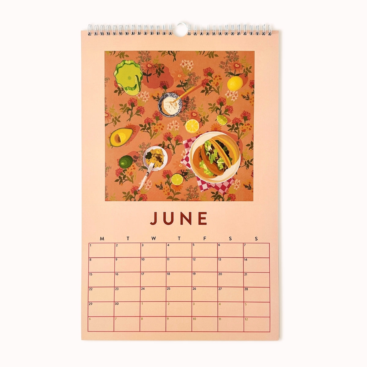 Calendar for June with food illustrations on a peach background