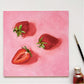 modern and contemporary original oil painting of bright red strawberries on a textured pink background