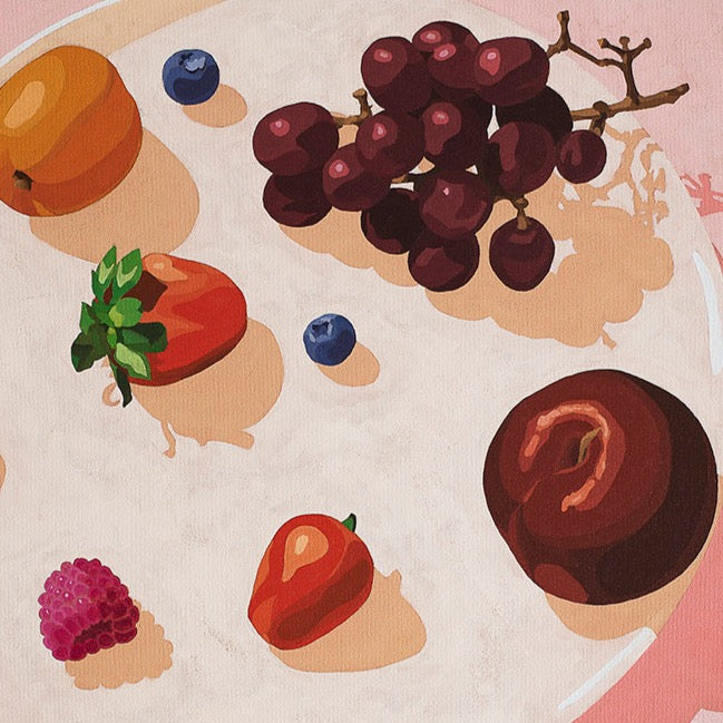 closeup of a fine art print of a plate with fruits on top, plum, blueberries, blackberry, strawberry, raspberry, grapes and an apricot with a soft pink background