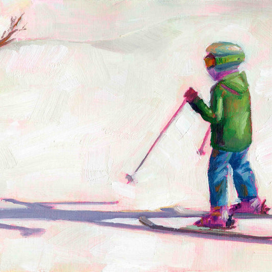 Skiier in a green jacket and colorful helmet on a snowy slope