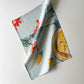 100 percent colourful linen tea towel of lemons on a light blue background