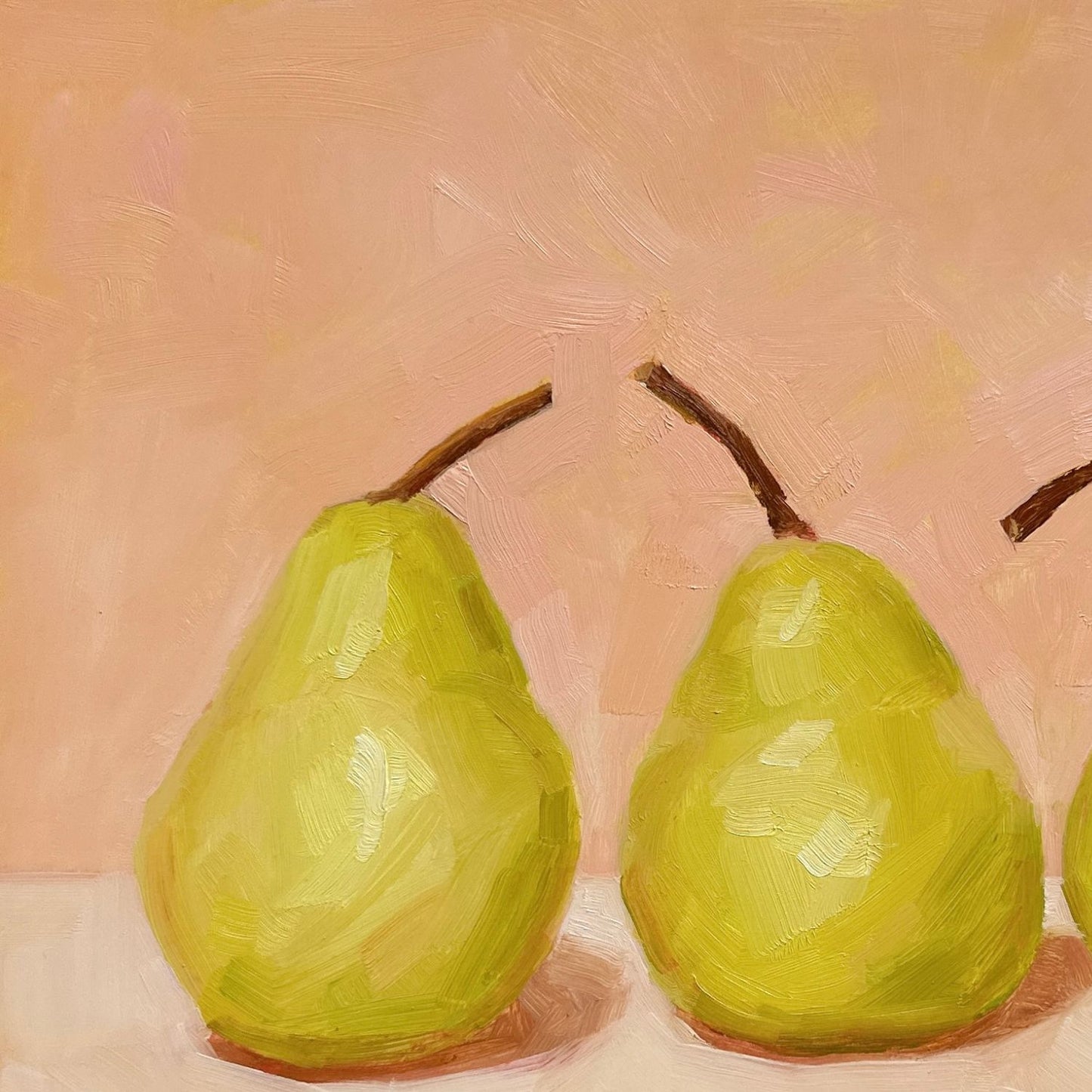 modern and contemporary oil painting of three soft green pears on a soft peach and cream background