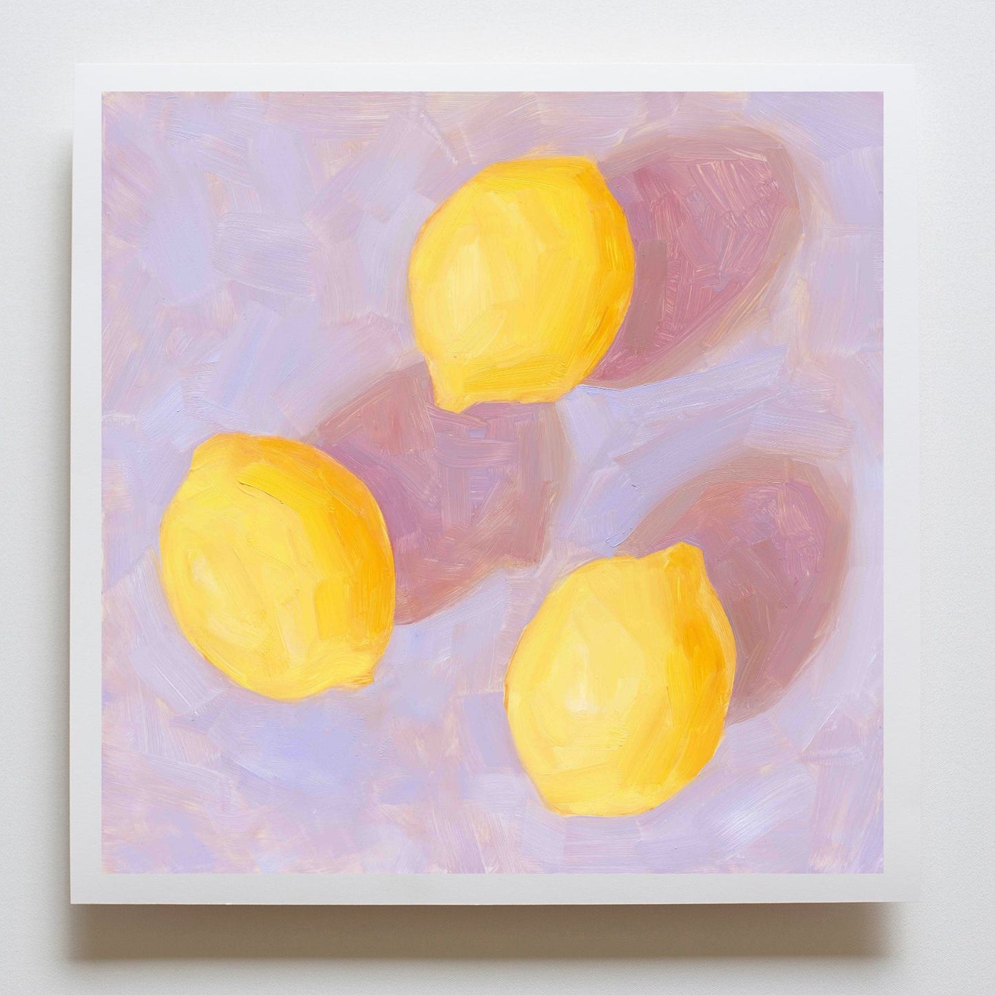 fine art paper print of an original oil painting of three vibrant lemons with strong pink shadows on a textured lilac background