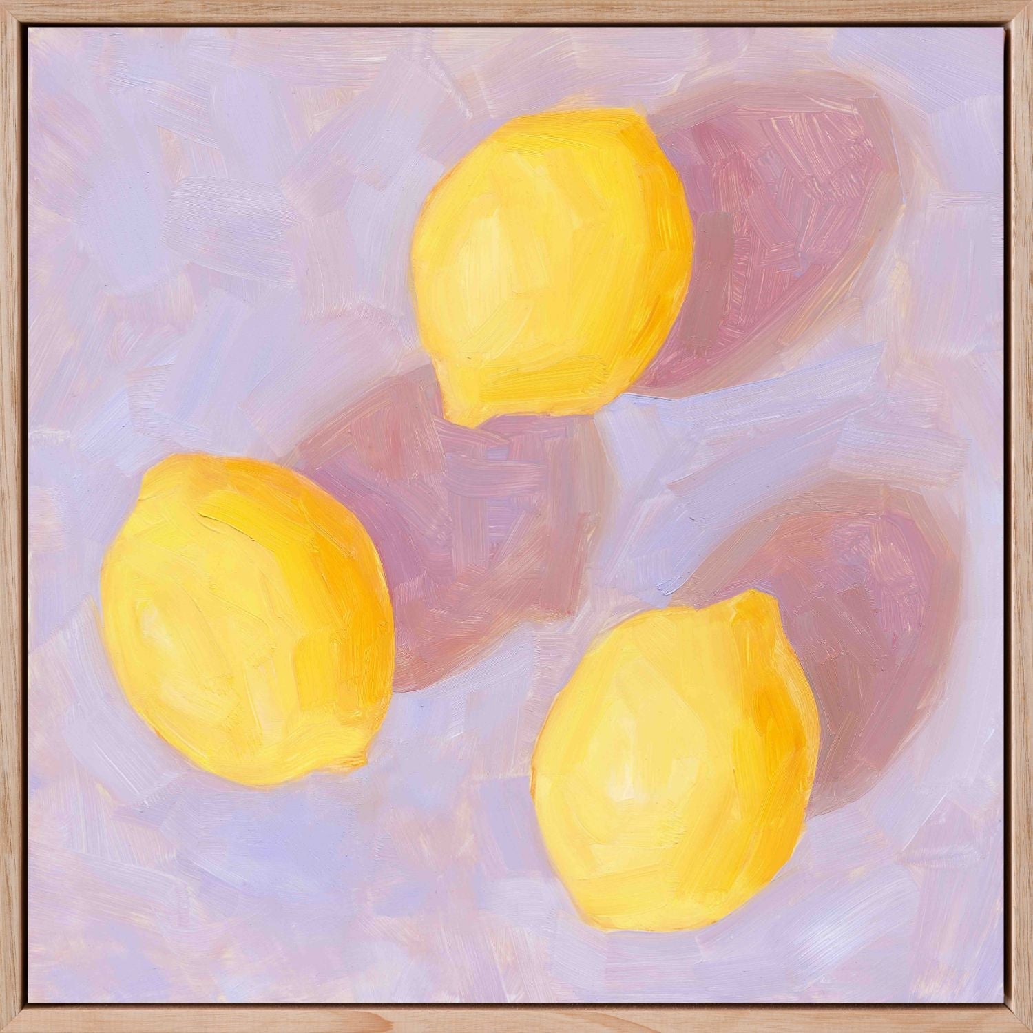 fine art framed canvas print of an original oil painting of three vibrant lemons with strong pink shadows on a textured lilac background