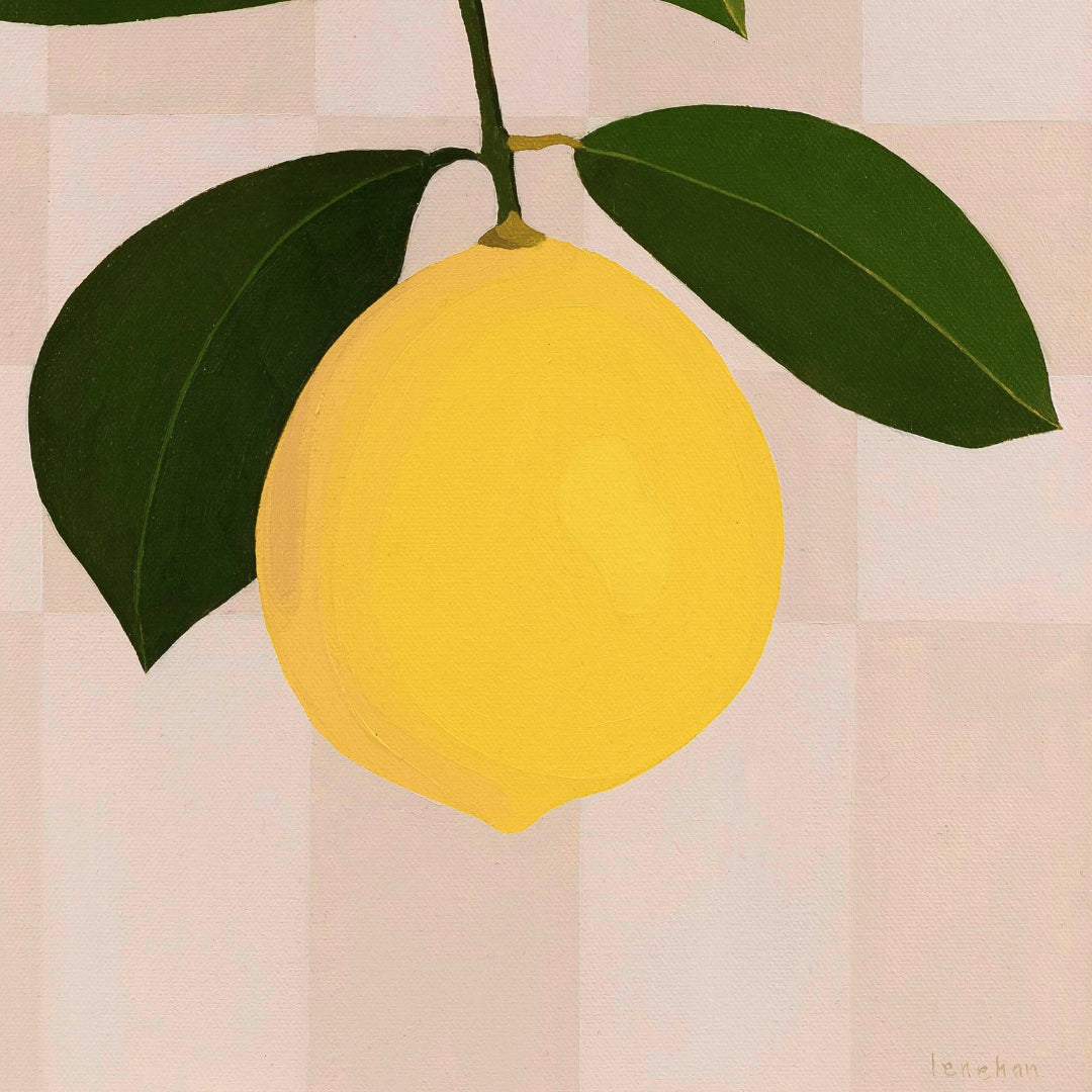 Yellow lemon with green leaves on a beige checkered background