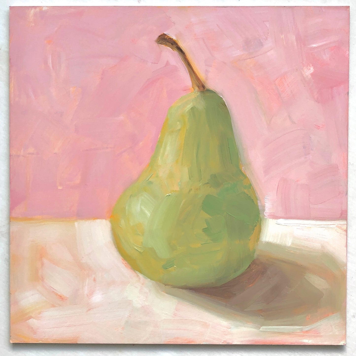photo of an impressionistic and realistic original oil painting on board of a green pear sitting on a soft pink and cream background