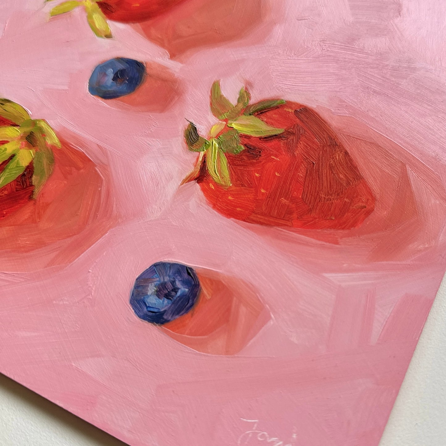 contemporary and modern oil painting of warm red strawberries and blueberries on a textured pink background