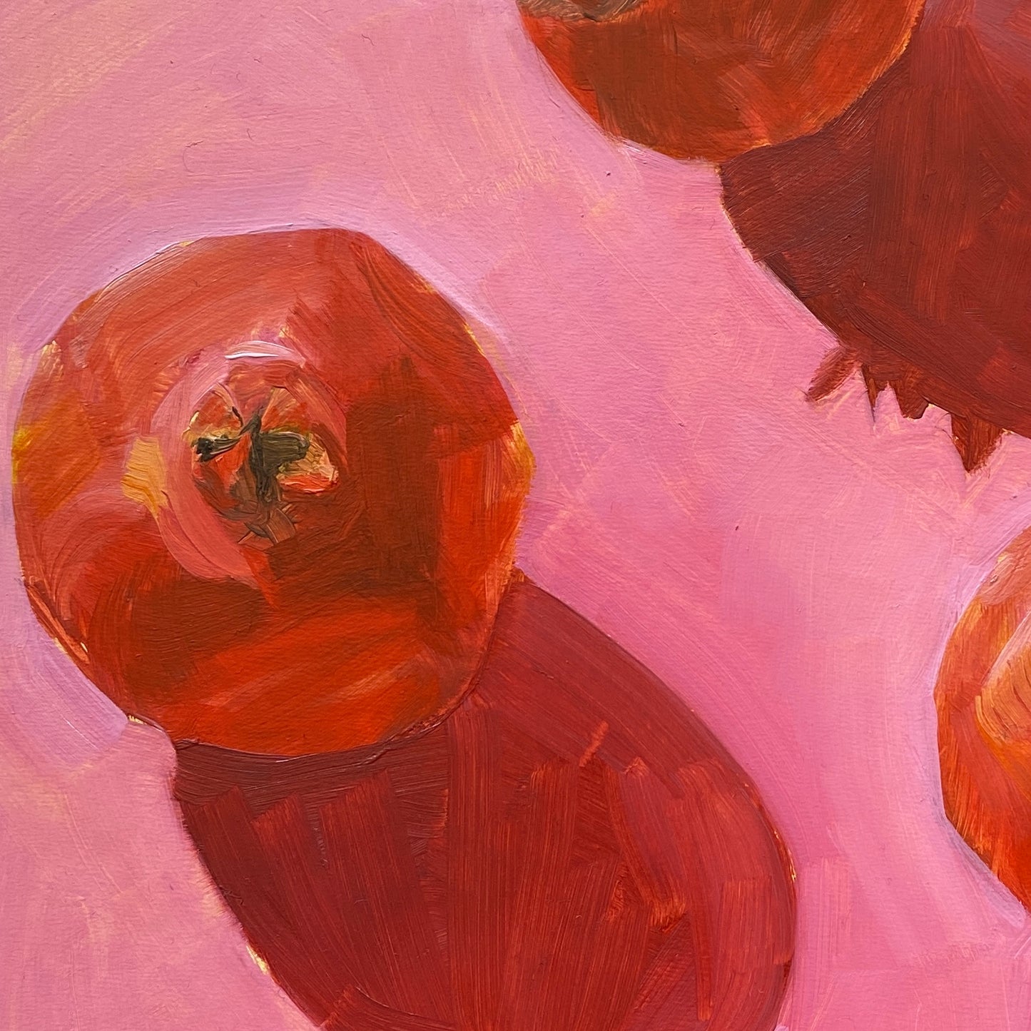 a close up of an image of an original oil painting on wooden panel of three red pomegranates on a bright pink background
