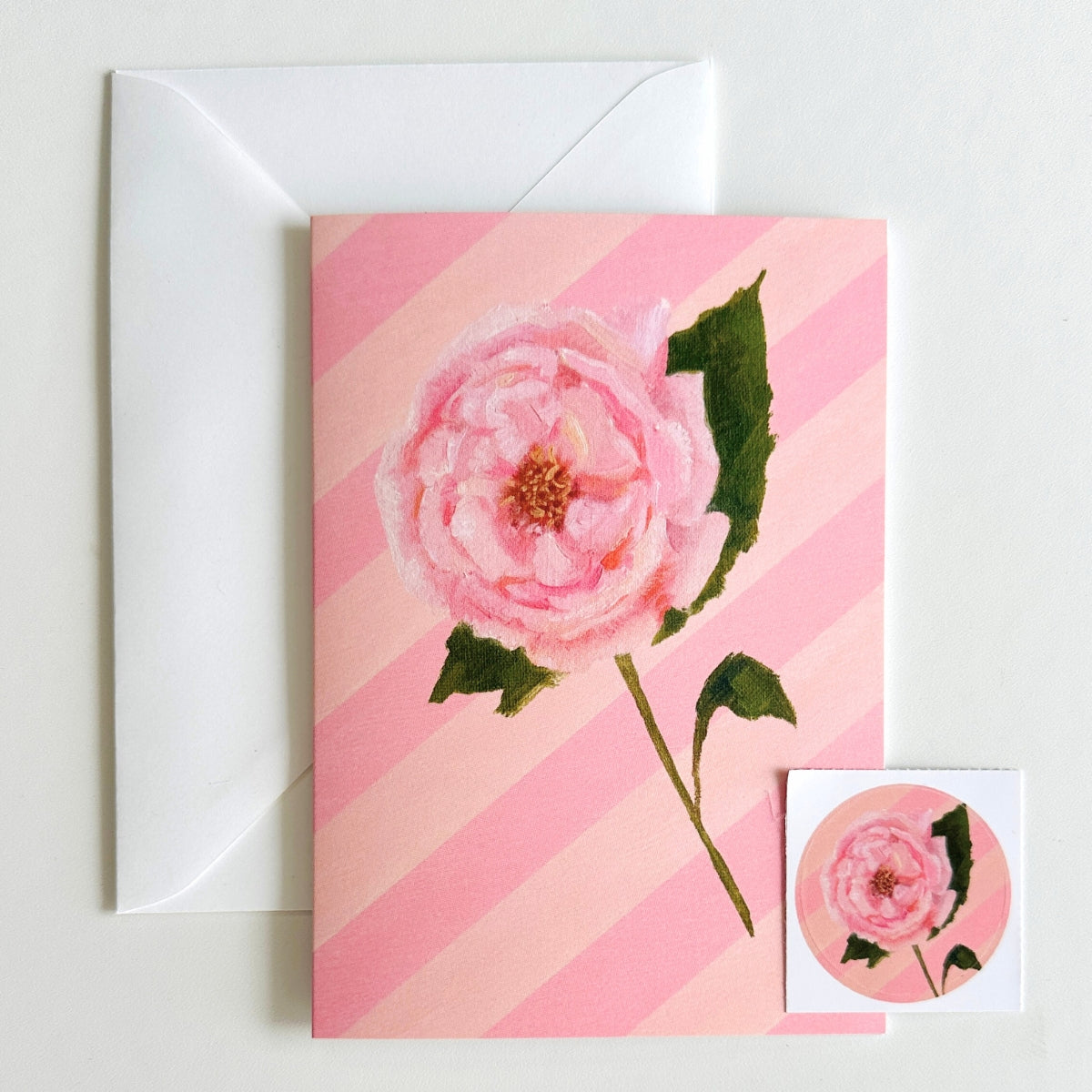 set of 4 greeting cards with pink and peachy stripes, pink scallops and a hand painted flowers. set comes with 4 matching stickers. blank inside