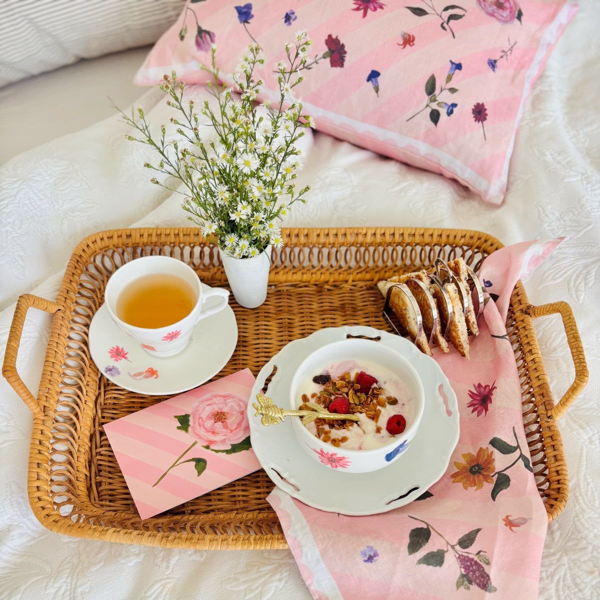100% linen cushion with pink scallops, pink and peachy stripes and hand painted flowers