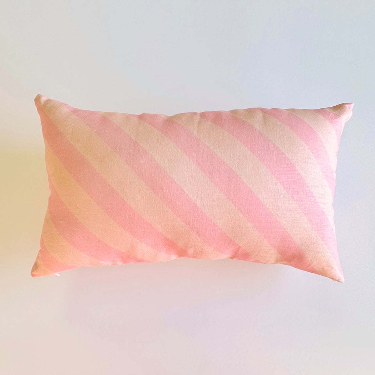 100% linen cushion with pink scallops, pink and peachy stripes and hand painted flowers