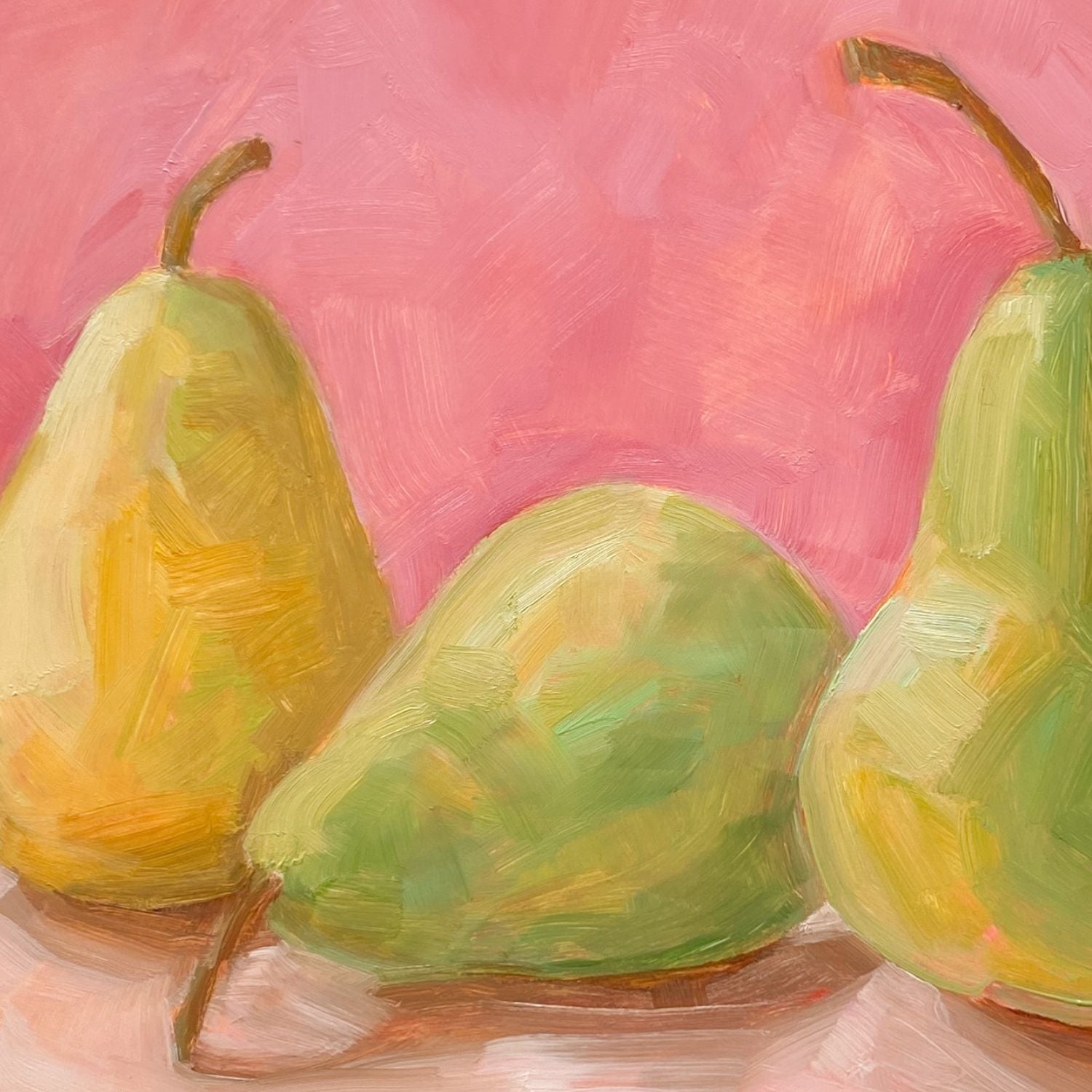 closeup of an image of an oil painting of two green pears and one yellow pear on a cream surface with a soft and warm pink background