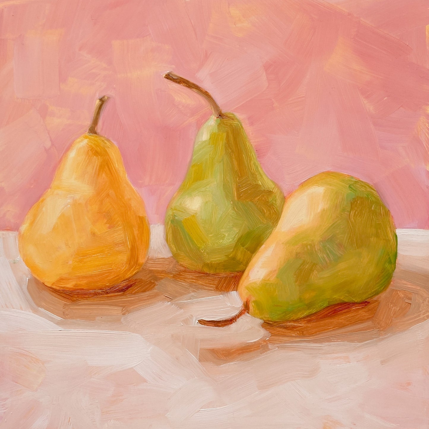 original oil painting of three yellow and green pears on a soft cream surface and a soft pink background painted in an impressionistic way
