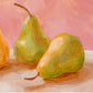 closeup of an original oil painting of three yellow and green pears on a soft cream surface and a soft pink background painted in an impressionistic way