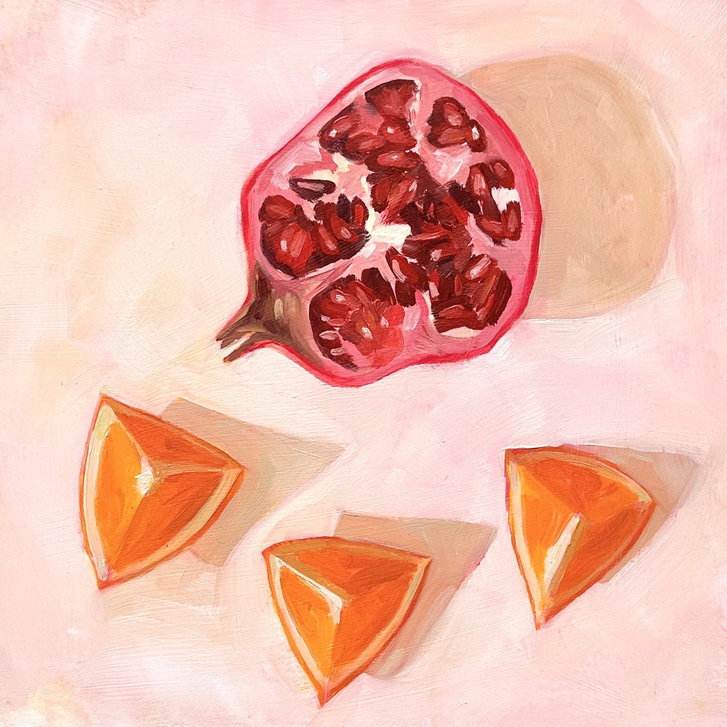impressionistic original oil painting of a still life setting of pomegranate fruit and three orange slices on a textured cream background with soft shadows